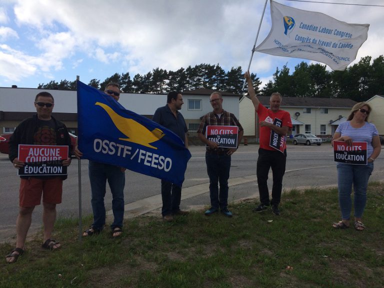 High school teachers rally outside Near North board office to protest layoffs