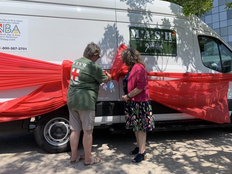AIDS group unveils outreach van on World Hepatitis Day